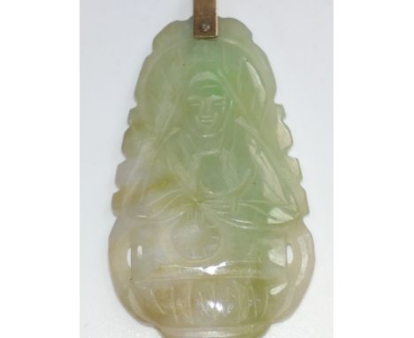 A carved jade pendant 4cm x 2.5cm. 