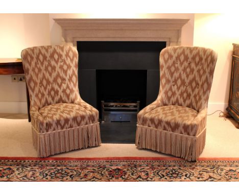 on mahogany legs and brass casters, with light brown and pale gold tasselled upholstery, 93cm highBears labels for Portman Up