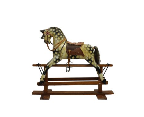probably first half twentieth century, gesso and painted, showing carved teeth, grey mane, leather and padded cloth saddle, m