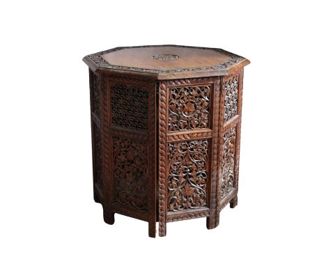 the octagonal top with foliate carved band above, pierced foliate and floral carved and pierced panels, two sides of the stru