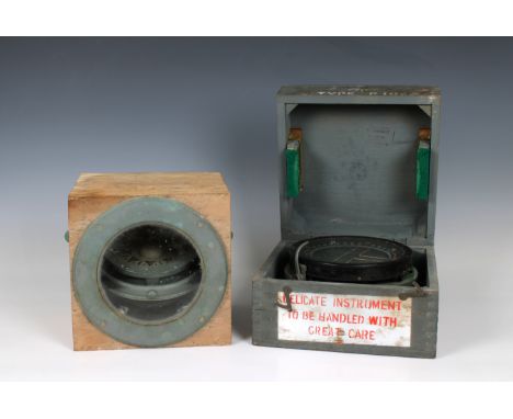 black painted finish, contained in its wooden transit box, together with a Sestrel brass cased ship's compass mounted on gimb