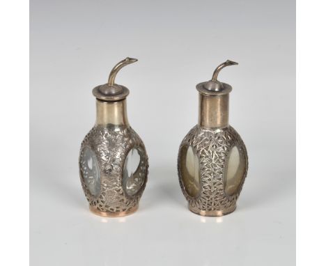 of three sided decanter form, decorated with pierced dragons, waves and bamboo, stamped sterling and various other marks, 4½i