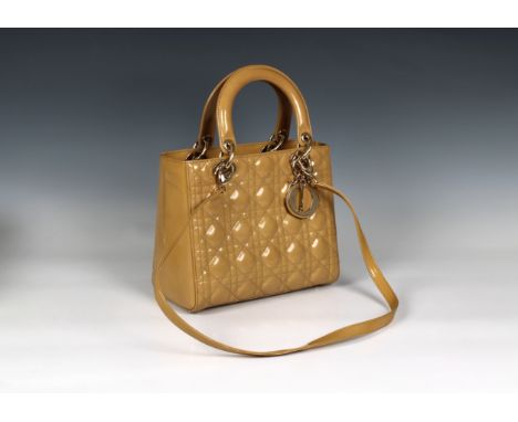 Cannage quilted lambskin with gilt gold tone hardware, zip top closure opening to interior zip pocket 24cm wide, 20cm high,10