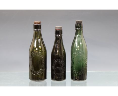 of varying styles and shades of green, one with original stopper, the others matched, the largest including stopper 10½in. (2