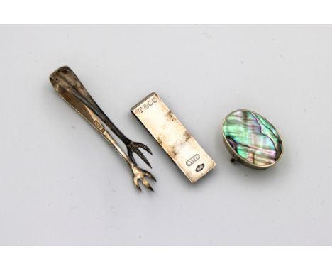 Cooper Brothers &amp; Sons Ltd, Sheffield, 1923, 4in. (10.2cm.) long, together with a silver money clip marked 925 and a silv