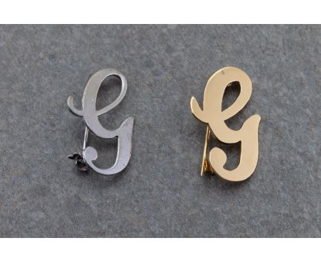 together with a silver 'G' brooch.