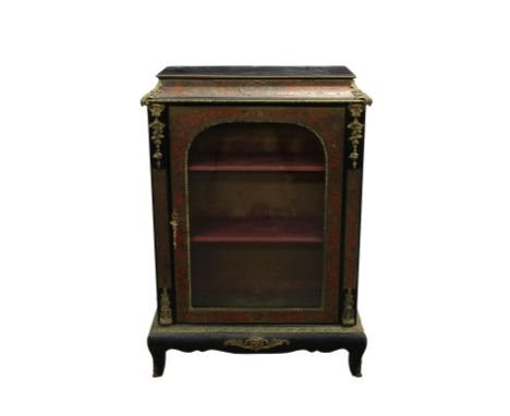 with ormolu mounts, the glazed door opening to shelving, 32 x 14in. (81.2 x 35.5cm.), 44½in. (113cm.) high.*Losses to the bra
