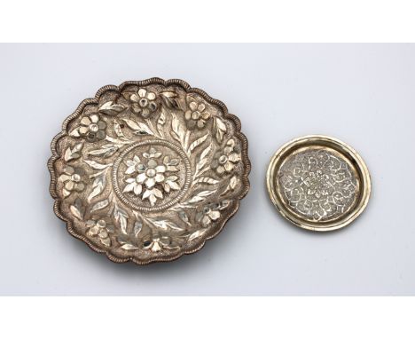 probably Middle Eastern, 5in. (12.7cm.) diameter, together with a silver miniature shallow dish decorated with a stylised des