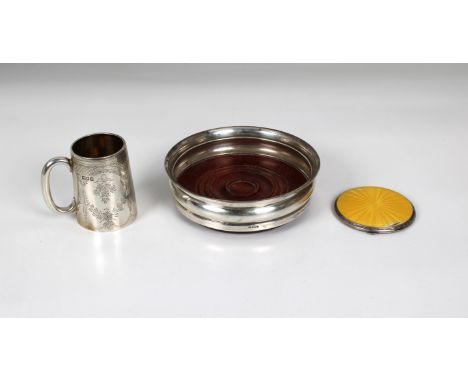 dating to 1910, maker's mark rubbed, 2¾in. (7cm.) high; wine coaster by Broadway &amp; Co, Birmingham,1997; silver and yellow