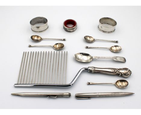 To include a silver handled cake rake marked "WEB STIRLING" together with a pair of silver napkin rings; bottle collar; Yard-