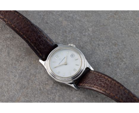 26mm. stainless steel case, white dial, Arabic numbers at 6, 9 and 12, date at 3 o'clock, silver batons, brown leather strap,