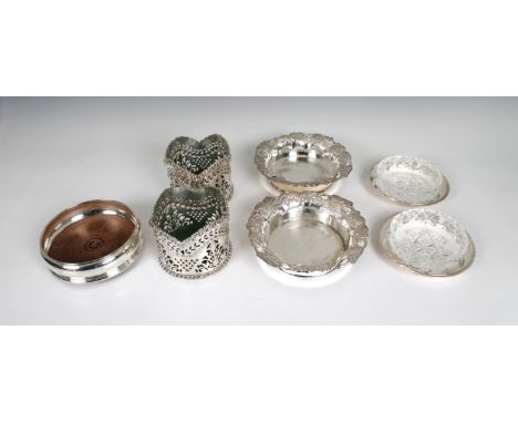 to include a silver wine coaster, M C Hersey &amp; Son Ltd, London, 1985, 5 1/8in. (13cm.) diameter, together with a pair of 