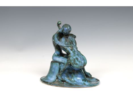 modelled in seated position, rising from oval base, signed 'EA' to underside, 7¾in. (19.7cm.) high.* Providence: By family de