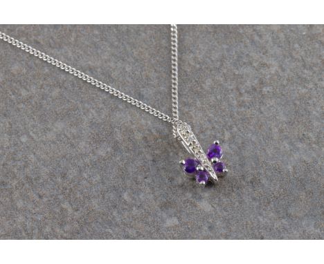 the 18ct white gold butterfly pendant with central diamond-set bale and four amethyst as wings to a 9ct white gold chain.