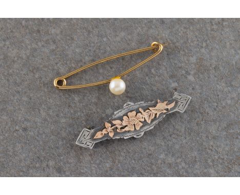 1 5/8in. (4.1cm.) together with a silver and gold bar brooch with a floral design 1½in. (3.8cm.). (2)