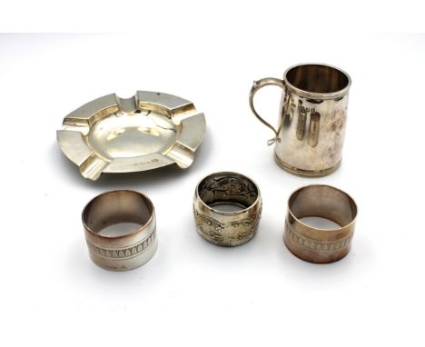 To include a silver napkin ring, Birmingham, 1903, engraved initials; pair of Christofle silver plated napkin rings; silver a