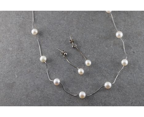 the silver snake chain set with eleven interspersed round white pearls approximately 7.8mm in diameter, together with matchin