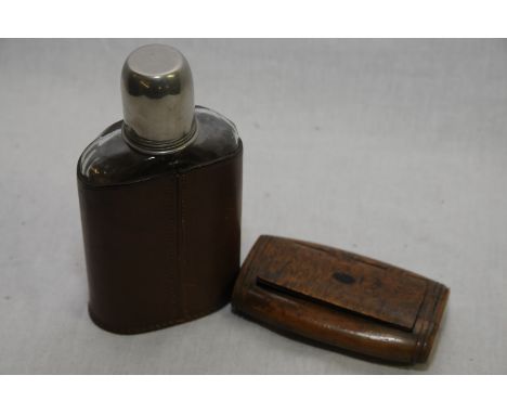 19th C oval horn snuff box with hinged lid (length 10cm) and a glass leather bound spirit flask with screw off plated top