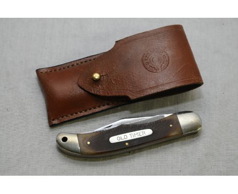 Old timer schrade USA 250t pocket knife with two folding 4inch blades with two piece checkered horn grips with leather pouch