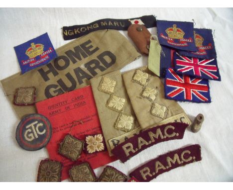 Selection of various military cloth insignia including British flags, officers pips, British Forces Commonwealth badges, Home