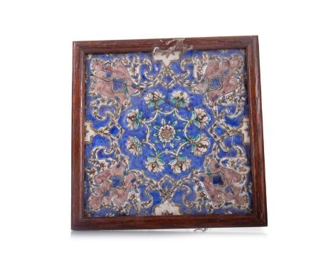 PERSIAN QAJAR POTTERY TILE SECOND HALF 19TH CENTURY square outline, relief moulded and decorated with arabesque foliate scrol