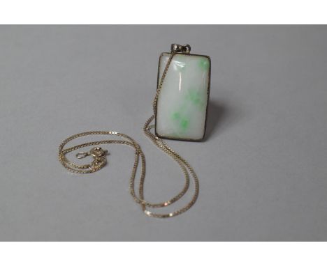 A White Jade with Apple Green Spots Pendant Mounted on a Silver Chain 