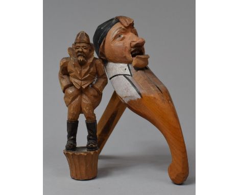 A Carved Wooden Black Forest Wine Saver Cork, Together with a Nutcracker 