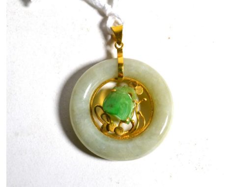 A jade pendant, a carved jade flower head amongst vines within a circular jade bi-disc, measures 4.5cm by 3.5cm.  stamped '58