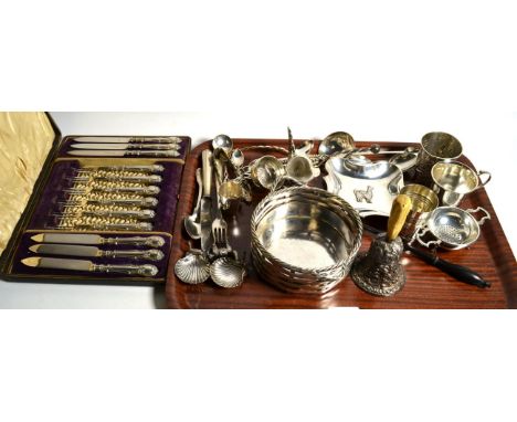 A group of assorted silver and white metal items to include a beaker, tea strainer, ladle etc, together with a cast silver pl