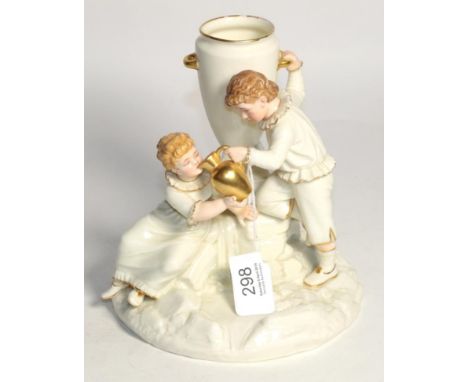 A Royal Worcester porcelain figure group of a boy and girl at a fountain by James Hadley, 17.5cm high
