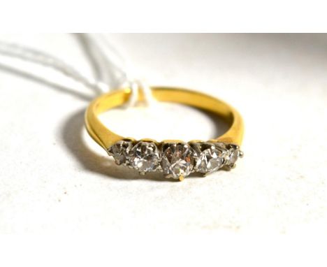 A five stone diamond ring, the old cut diamonds in white claw settings, to yellow knife edge shoulders on a plain polished sh