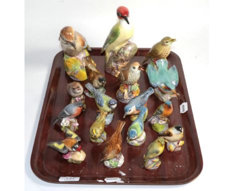 A collection of seventeen Royal Worcester bone china birds, gloss finish (17)