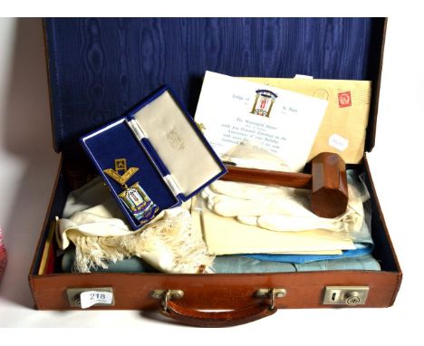 A leather case containing assorted Masonic memorabilia including a silver and enamel jewel, together with assorted First Worl