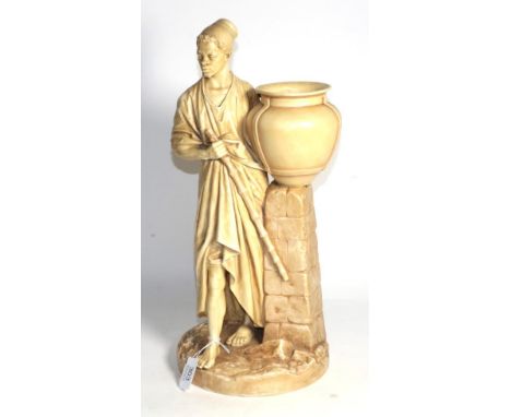 A Royal Worcester porcelain figure of a water carrier, dated 1884, modelled by James Hadley, the standing figure holding a ba