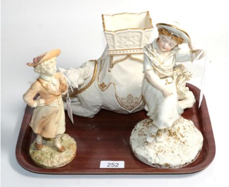 A group of Royal Worcester including a recumbent camel with incised signature 'Hadley', a dancing girl model No. 1129, a Viva