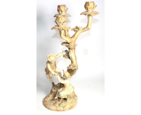 A Victorian Royal Worcester figural candelabra, circa 1890, modelled by James Hadley, 50cm high 