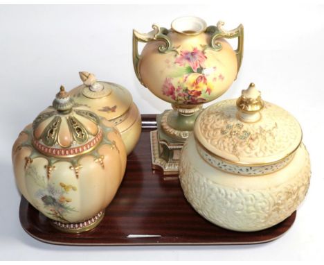 A group of Royal Worcester blush ground porcelain wares comprising three pot pourri vases and covers and a twin handled vase 