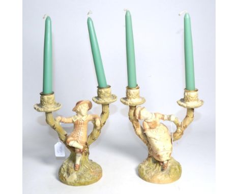 A pair of Victorian Royal Worcester figural candelabra, circa 1890, modelled by James Hadley, 1125, 23cm high 