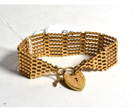 A gate link bracelet with an attached 9 carat gold heart shaped padlock clasp, length 18cm .  Gross weight - 26.24 grams. 