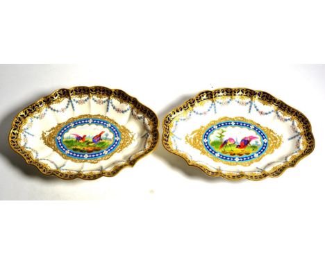 A pair of Victorian Worcester porcelain oval dishes, dated code for 1878, in the manner of James Giles, hand painted with exo
