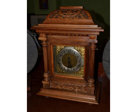 A walnut quarter striking table clock 