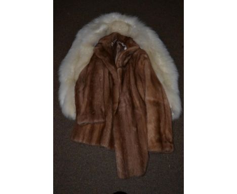 A light mink fur coat and a white fox fur stole (2)