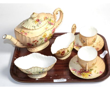A group of Royal Worcester blush ground porcelain tea wares comprising teapot, cream, sugar and a pair of coffee cans and sau