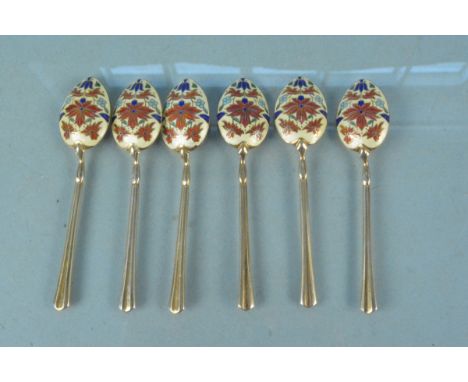 An unusual set of six silver gilt enamel decorated teaspoons, each bowl with enamelled floral design to back, hallmarked Birm