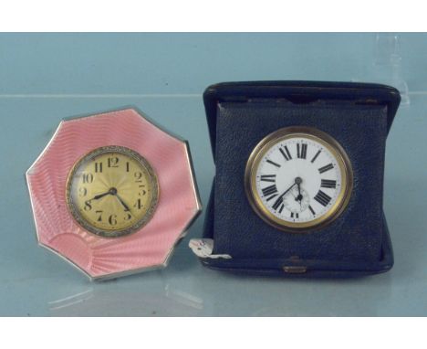 A silver enamelled early 20th Century desk clock together with another cased desk clock