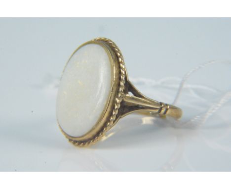 A 9ct gold large oval opal set ring, size O, weight approx 4g
