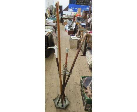 A brass stick stand and various canes&nbsp;