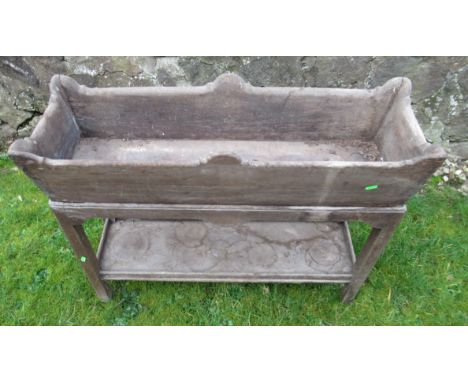 An antique oak planter raised on a stand in distressed condition&nbsp;