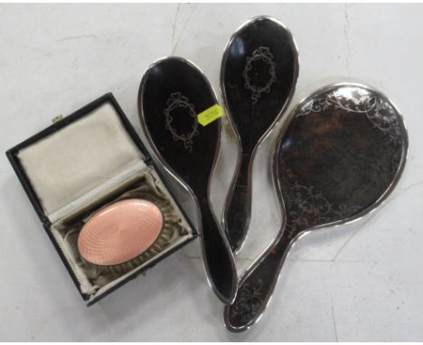 Two silver and tortoiseshell dressing table brushes, together with a silver and tortoiseshell dressing table mirror and a cas