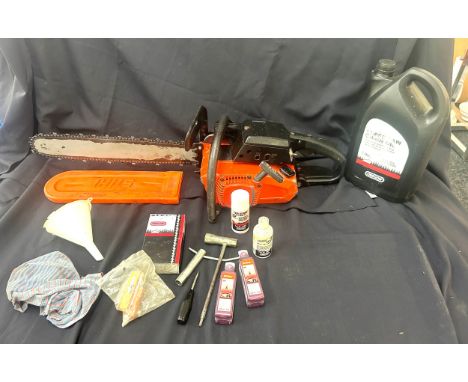 Petrol chainsaw and accessories in working order 
